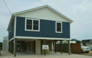 A house with blue siding and a blue roof.