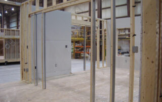 A room that is under construction with wooden framing.