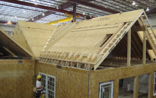 The roof of a house is being built.