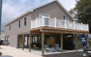 A house with a deck and a porch.