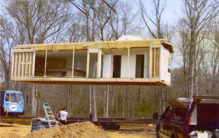 A house being built in a container.