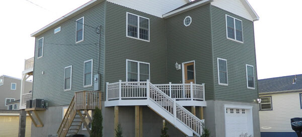 A house with a garage on the side of it.